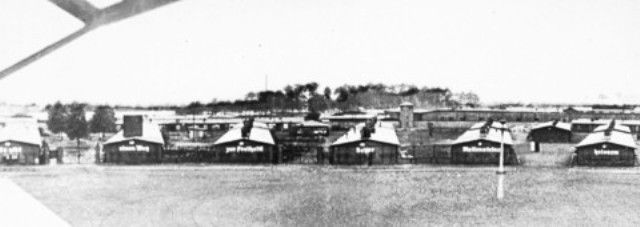 View of the prisoners' barracks in Sachsenhausen, with Nazi slogans painted on the front